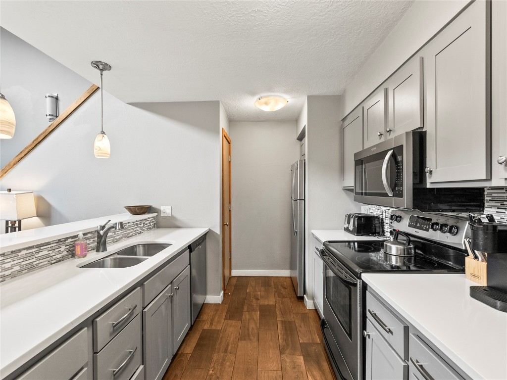 22320 Highway 6, Unit 1761 Keystone, CO 80435 - Photo 19 of 33 a kitchen with a sink stove and microwave