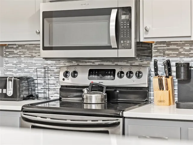 a bedroom with a large bed and a large window