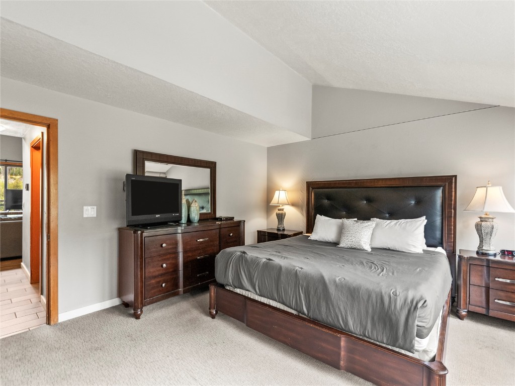 22320 Highway 6, Unit 1761 Keystone, CO 80435 - Photo 22 of 33 a bedroom with a bed and a television