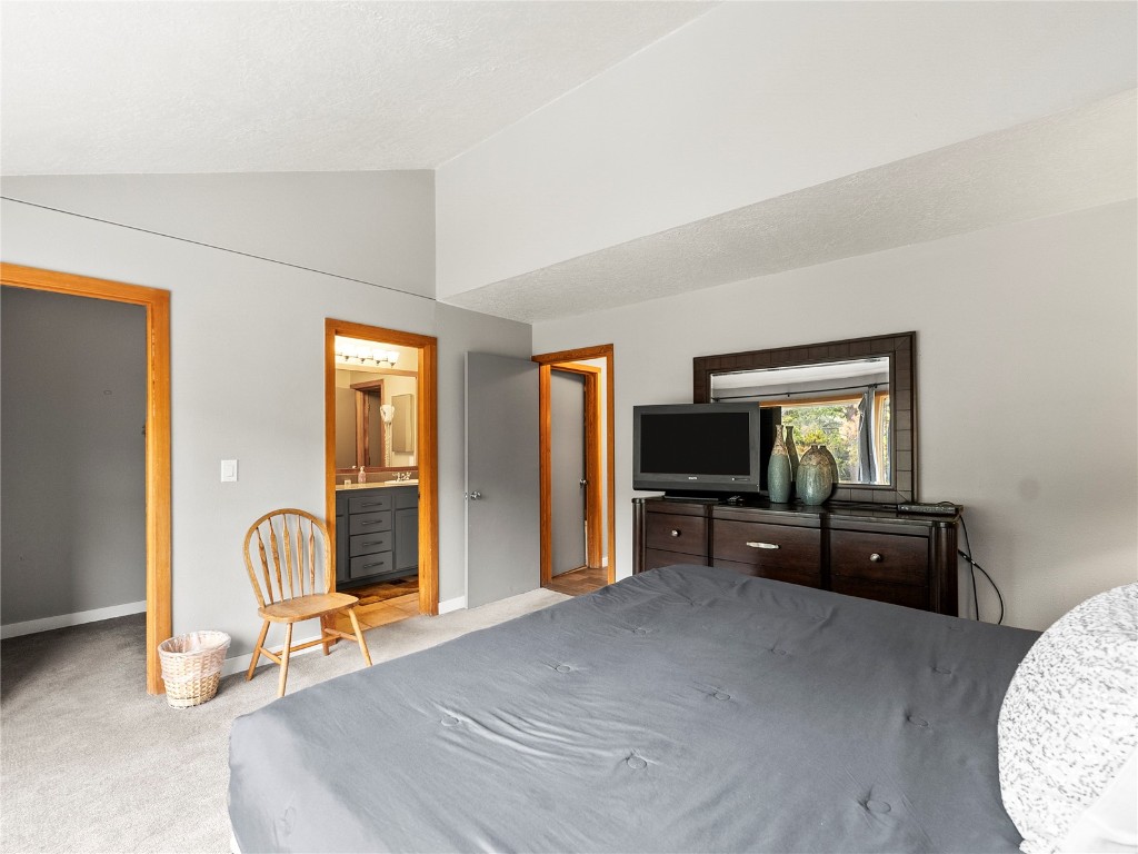22320 Highway 6, Unit 1761 Keystone, CO 80435 - Photo 23 of 33 a living room with furniture and a flat screen tv