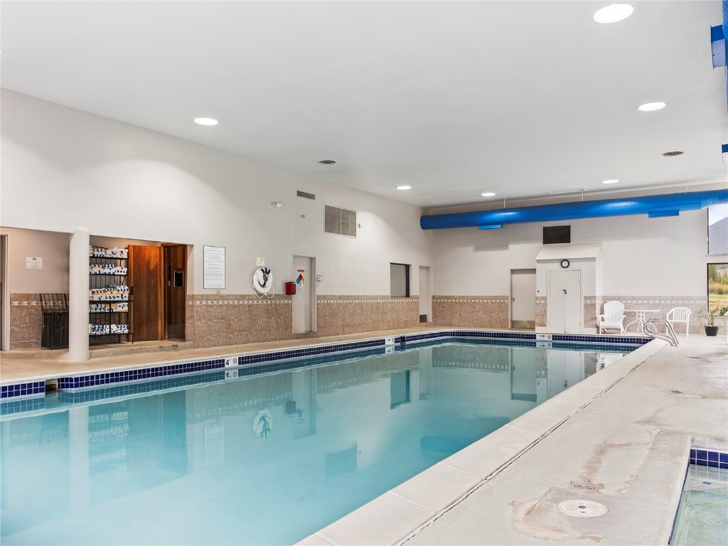22320 Highway 6, Unit 1761 Keystone, CO 80435 - Photo 31 of 33 a kitchen with stainless steel appliances granite countertop a sink and a stove