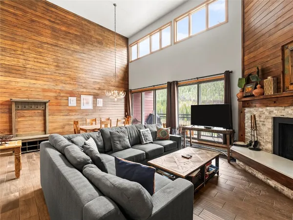 a living room with fireplace furniture and a flat screen tv