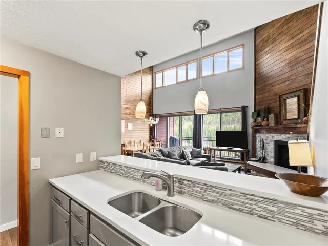 a kitchen with a sink cabinets and a large window
