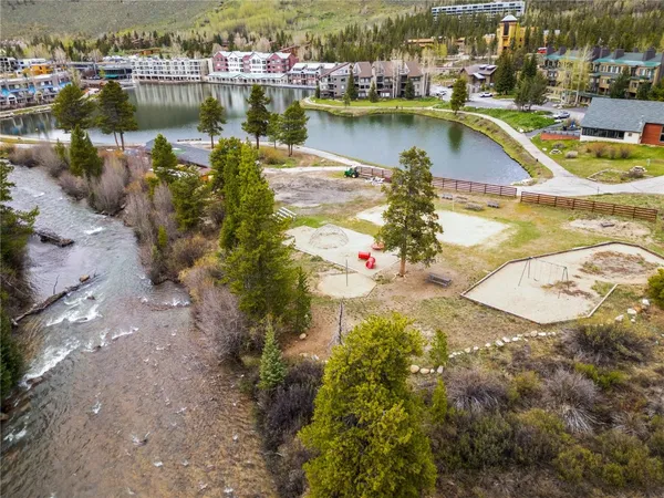 an aerial view of a house with a lake view