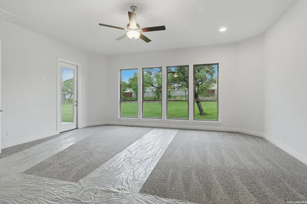 a view of an empty room with a window