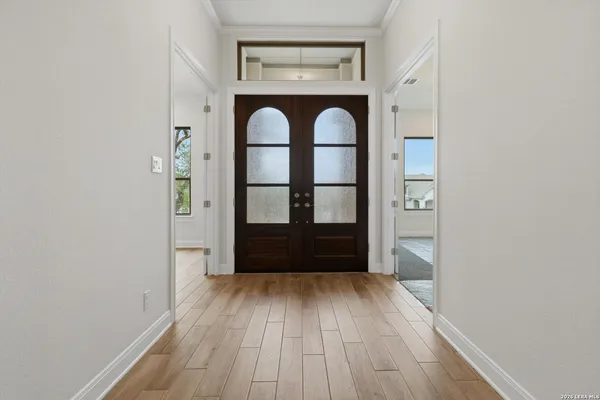 a view of entryway with wooden floor