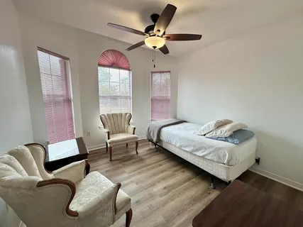 a living room with furniture and a window
