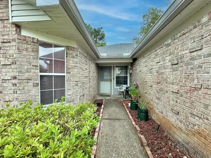 a view of house with backyard