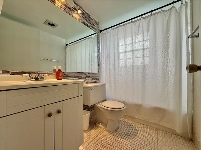 a view of a street with sitting area