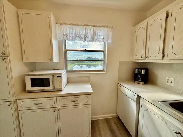 a view of a room with gym equipment and a large mirror