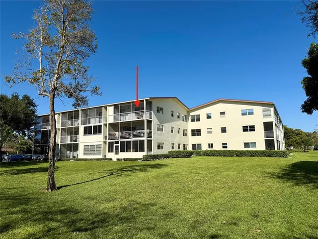 a view of a lake with houses in the background