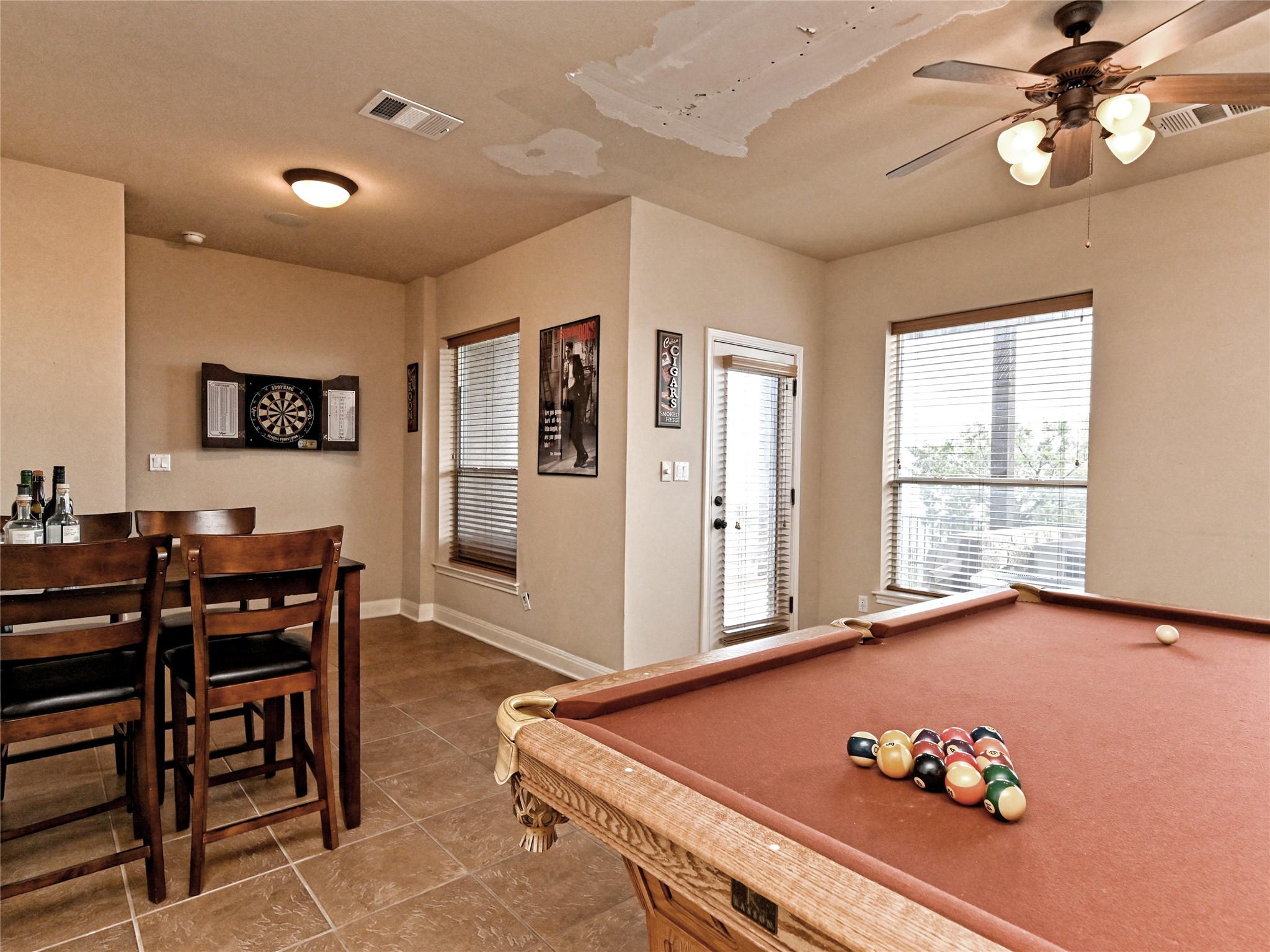 230 Sunrise Ridge Loop Austin, TX 78738 - Photo 15 of 27 Game room with ample lighting provides space for entertaining and relaxation.