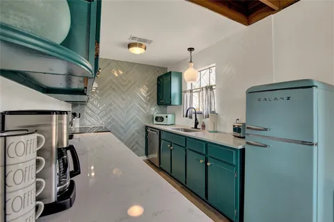 a bathroom with a double vanity sink and mirror