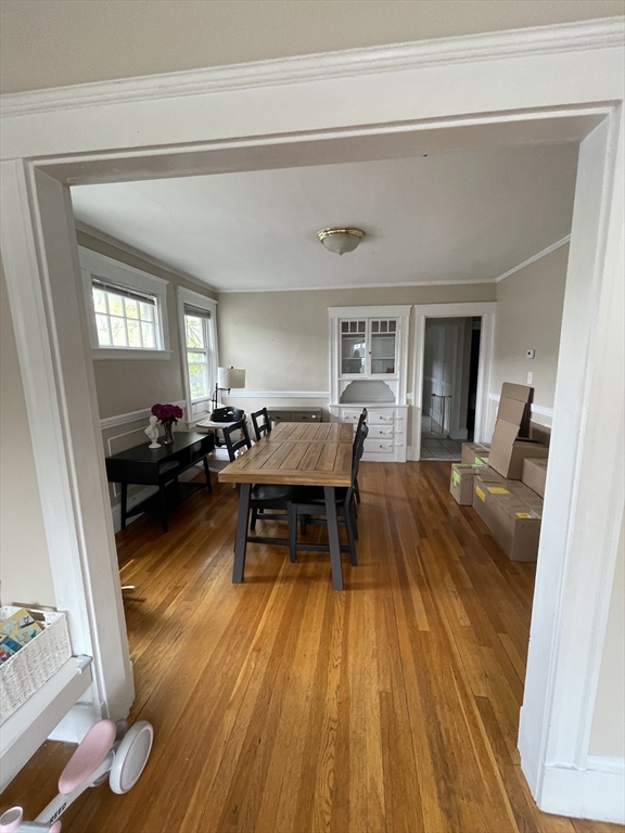 29-31 Bradford Road, Unit 31 Watertown, MA 02472 - Photo 5 of 11 a living room with furniture and a wooden floor