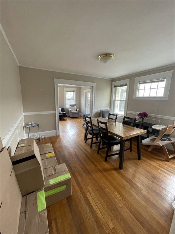 29-31 Bradford Road, Unit 31 Watertown, MA 02472 - Photo 6 of 11 a living room with furniture a rug and a window