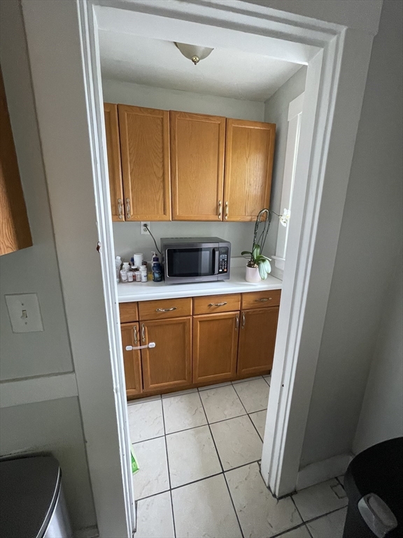 29-31 Bradford Road, Unit 31 Watertown, MA 02472 - Photo 8 of 11 a utility room with a sink a washer and dryer