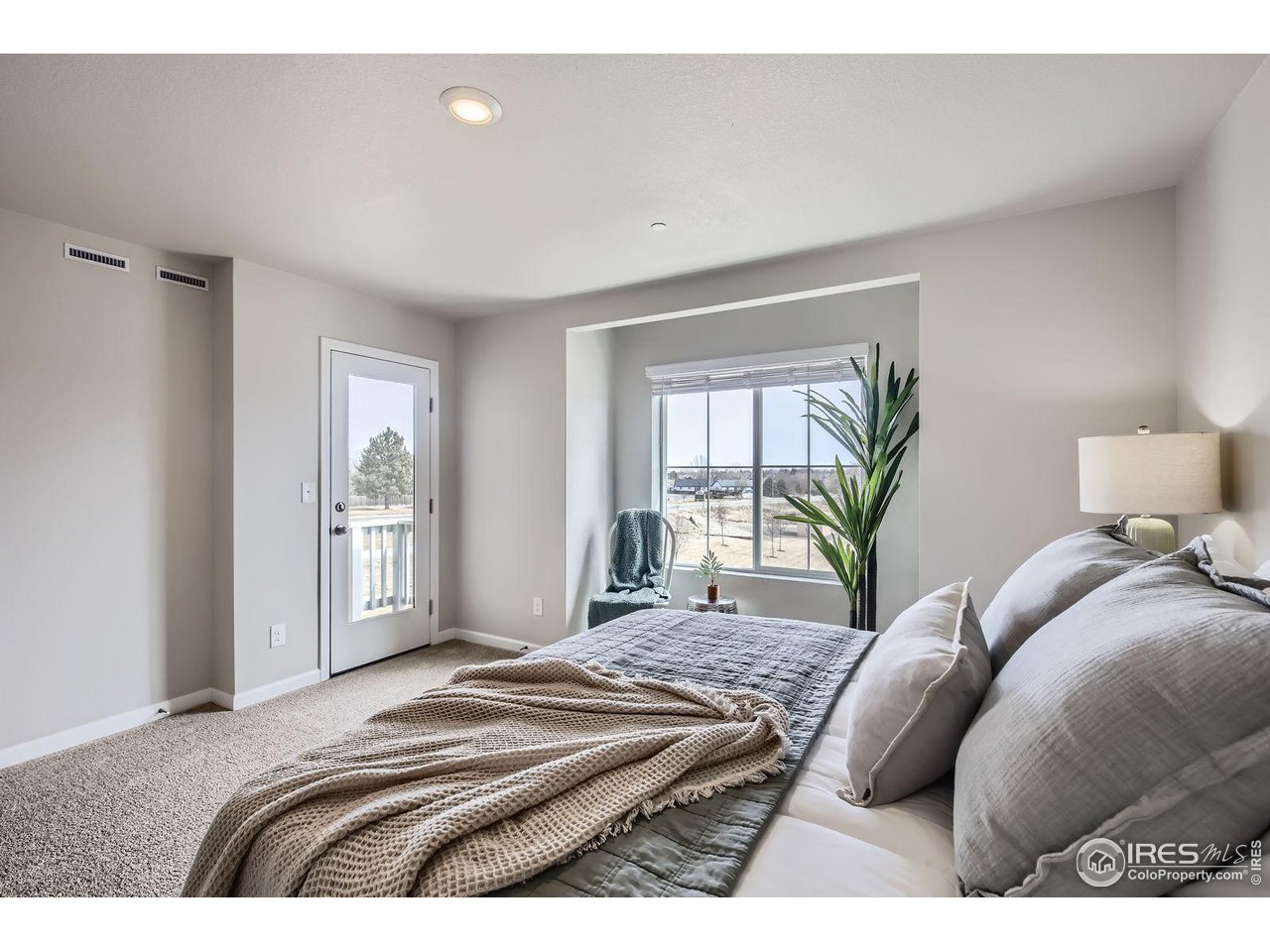 141 Robin Road Johnstown, CO 80534 - Photo 11 of 38 Primary Bedroom with Balcony