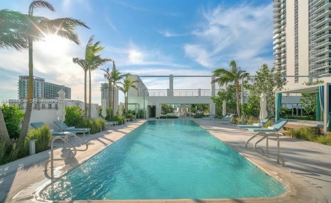 700 Northeast 26th Terrace, Unit 5006 Miami, FL 33137 - Photo 16 of 18 a view of a backyard with a patio