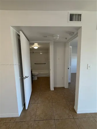 a bathroom with a sink toilet a mirror and shower