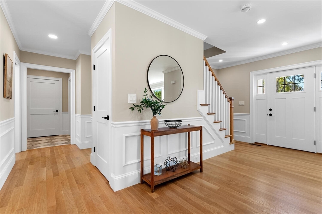 199 Nahant Street Wakefield, MA 01880 - Photo 16 of 39 a view of a hallway with wooden floor and furniture