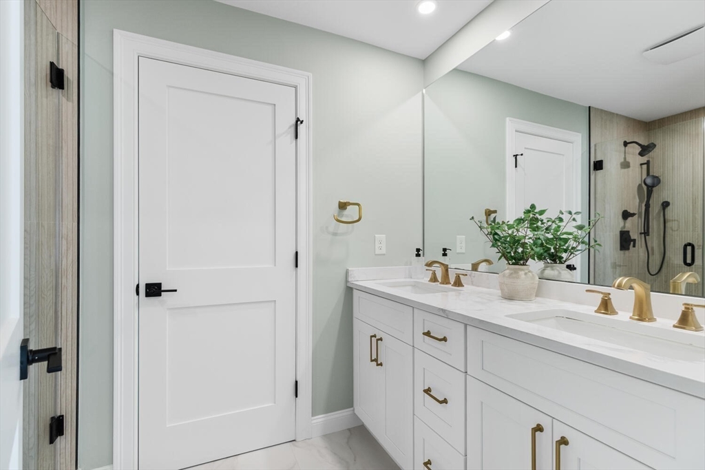 199 Nahant Street Wakefield, MA 01880 - Photo 21 of 39 a bathroom with a granite countertop sink and a mirror