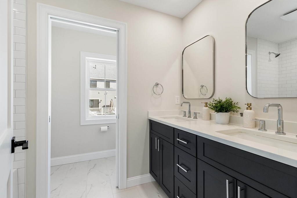 199 Nahant Street Wakefield, MA 01880 - Photo 25 of 39 a bathroom with a double vanity sink mirror and next