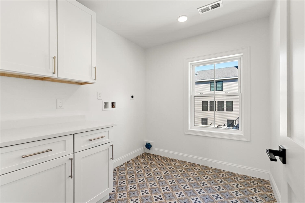 199 Nahant Street Wakefield, MA 01880 - Photo 29 of 39 a bathroom with a sink and a window