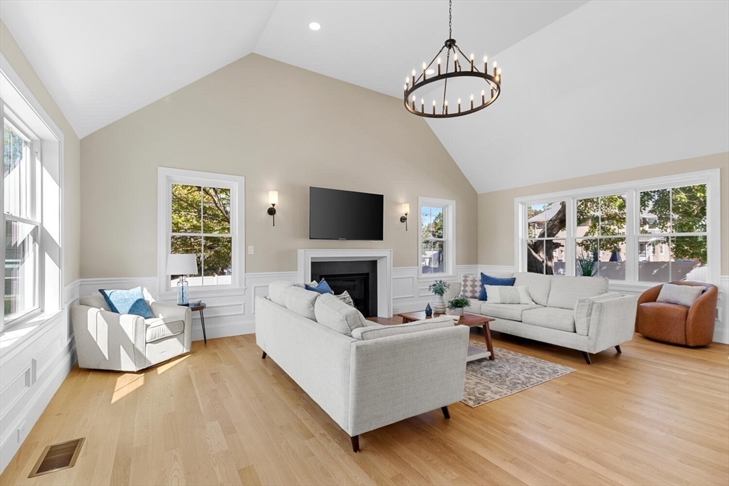 199 Nahant Street Wakefield, MA 01880 - Photo 8 of 39 a living room with fireplace furniture and a large window