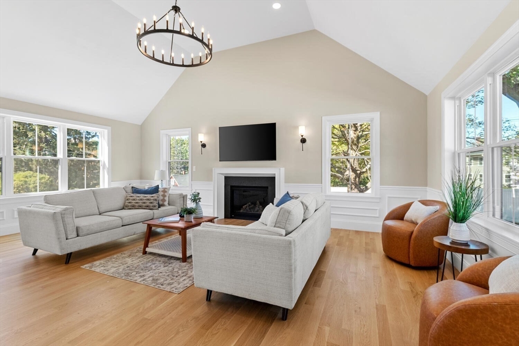 199 Nahant Street Wakefield, MA 01880 - Photo 9 of 39 a living room with furniture a fireplace and a large window