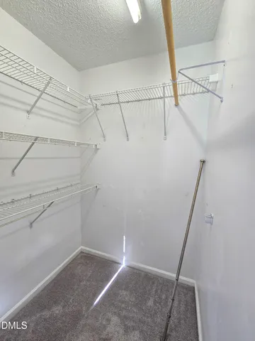 a bathroom with a granite countertop sink and mirror