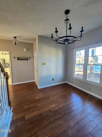a view of a livingroom with wooden floor