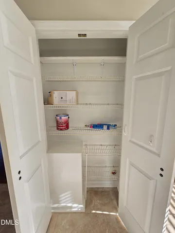 a view of empty room with windows