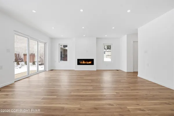 a kitchen with stainless steel appliances a refrigerator sink and microwave