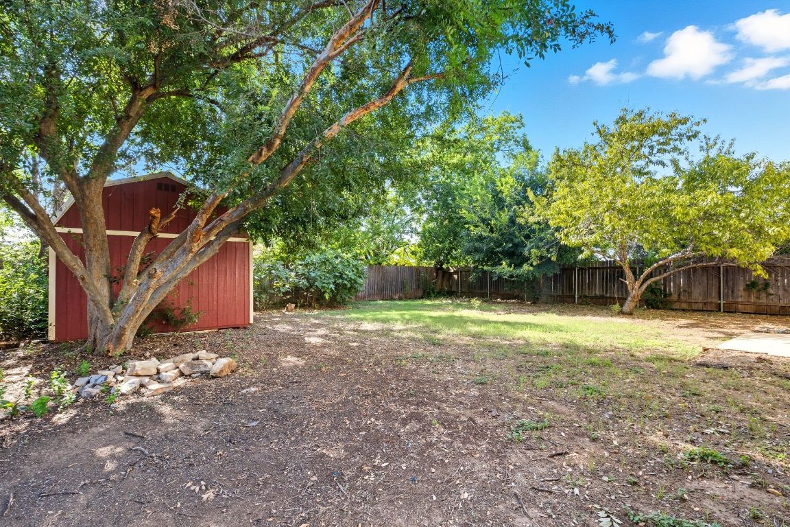 617 Riverway Lane Leander, TX 78641 - Photo 2 of 33 a backyard of a house with lots of green space