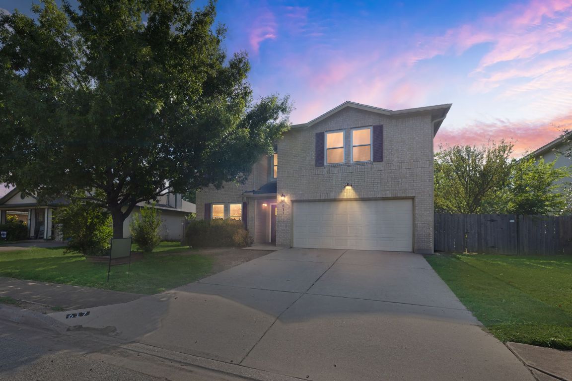 617 Riverway Lane Leander, TX 78641 - Photo 6 of 33 a front view of a house with a yard and garage