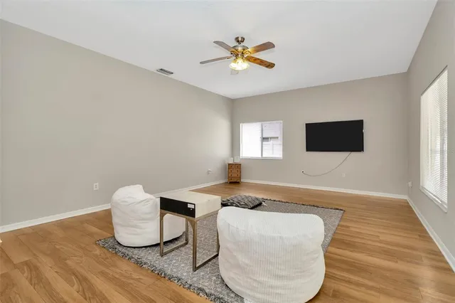 a living room with couch and a flat screen tv