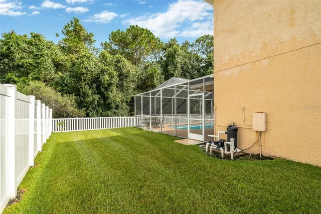 a view of a chair and table on the wooden deck