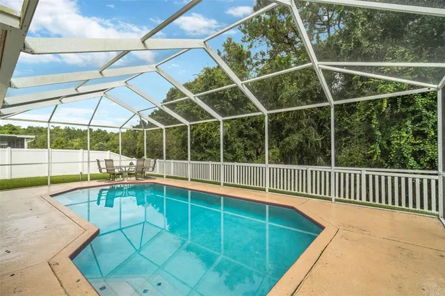 a view of a backyard with a wooden deck