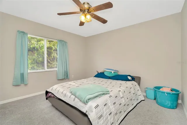 a swimming pool with outdoor seating yard and glass windows