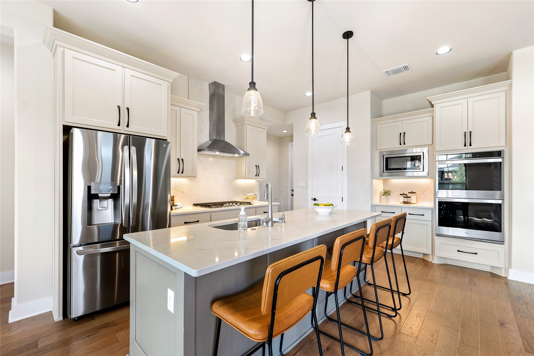 2408 Nate's Place Georgetown, TX 78633 - Photo 11 of 40 Culinary creations come alive in this meticulously appointed kitchen featuring an expansive central island and premium appliances.