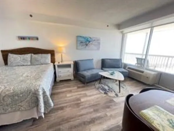 a living room with furniture and a large window