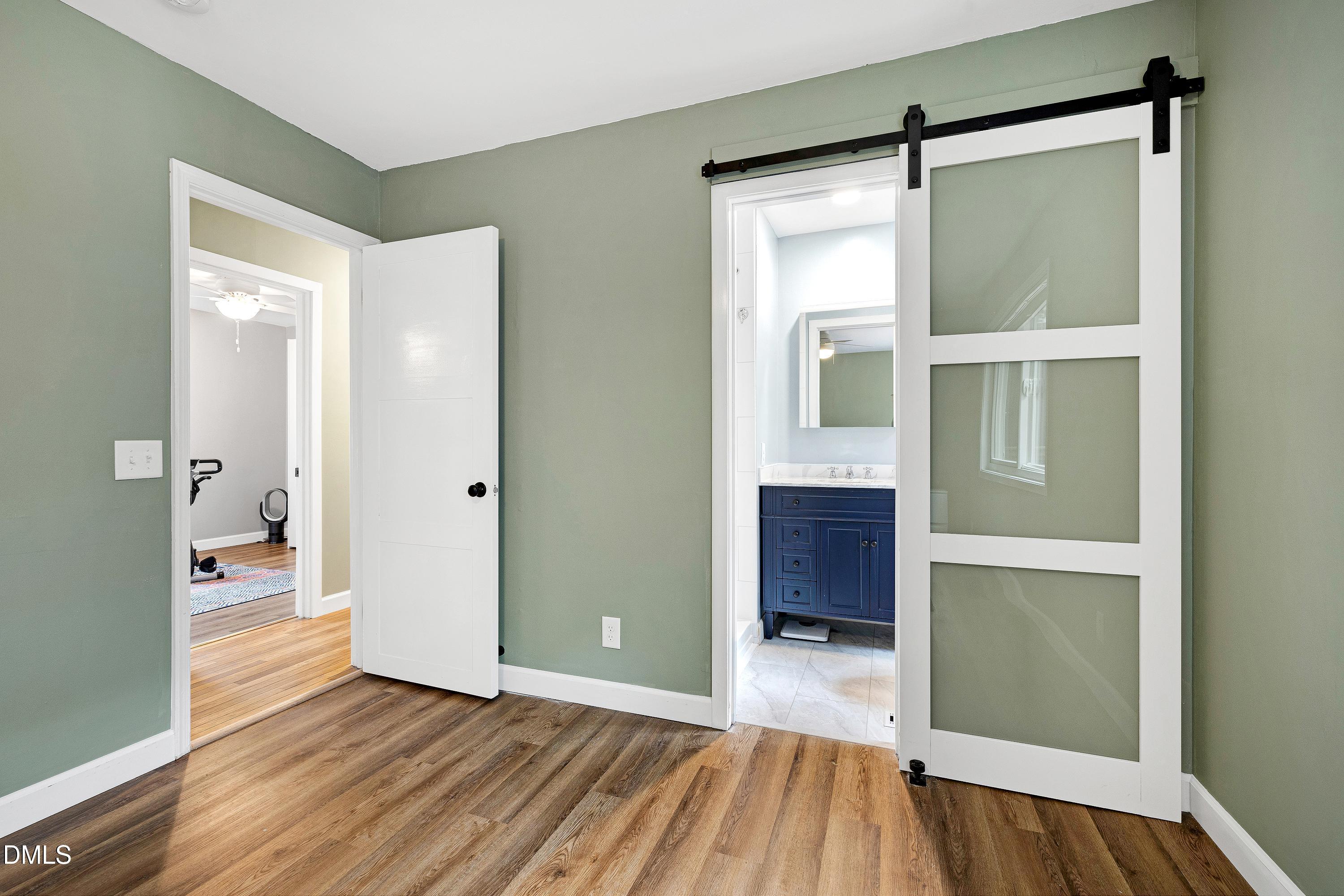5817 Newhall Road Durham, NC 27713 - Photo 22 of 51 Space saving Barn Door to Primary Bath
