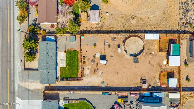 an aerial view of residential houses and outdoor space