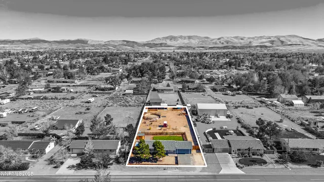 an aerial view of residential houses with outdoor space