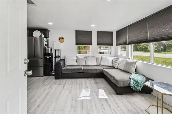 a living room with furniture and a large window