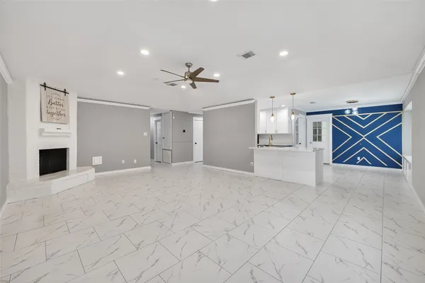 a view of an empty room with a fireplace