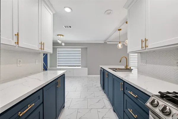 a kitchen with a sink and cabinets