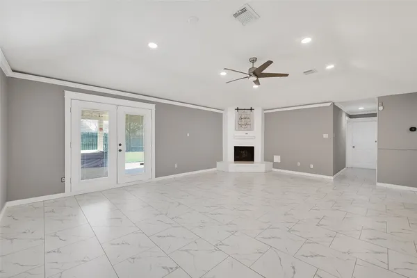 a view of an empty room with a window