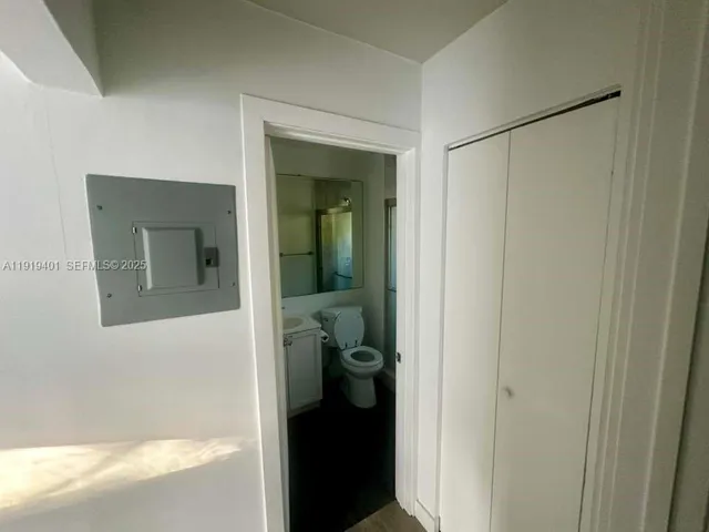 a view of a bathroom from a hallway