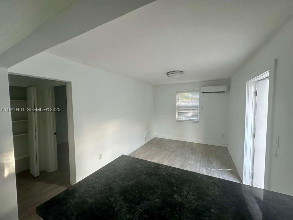 1150 Southwest 22nd Street, Unit 1 Miami, FL 33129 - Photo 6 of 13 an empty room with windows